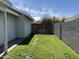 Well maintained backyard features a lawn and a gate to the side yard at 614 W 7Th Ave, Mesa, AZ 85210