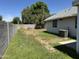 Backyard featuring a block wall and some grass at 614 W 7Th Ave, Mesa, AZ 85210