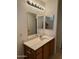 Bathroom featuring a new light fixture, double mirror, single sink vanity, and neutral-colored walls at 614 W 7Th Ave, Mesa, AZ 85210