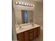 Bathroom featuring double sinks, a large mirror, and spacious vanity at 614 W 7Th Ave, Mesa, AZ 85210