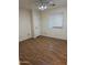 Bedroom with wood look flooring, a ceiling fan, and a window with white blinds providing natural light at 614 W 7Th Ave, Mesa, AZ 85210