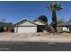 Charming single-Gathering home with a two-car garage, desert landscaping, and a mature palm tree at 614 W 7Th Ave, Mesa, AZ 85210