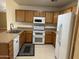 Fully equipped kitchen with stainless steel appliances and ample cabinet space at 614 W 7Th Ave, Mesa, AZ 85210