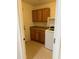 Convenient laundry room with ample storage cabinets and counter space for folding at 614 W 7Th Ave, Mesa, AZ 85210