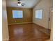 Bright living room with wood floors, a ceiling fan, and lots of natural light coming in at 614 W 7Th Ave, Mesa, AZ 85210