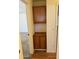 Hallway storage featuring wood cabinet, neutral walls and white trim and accents at 614 W 7Th Ave, Mesa, AZ 85210