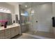 Modern bathroom with a double vanity, large mirror, and luxurious walk-in shower at 6225 S Boulder St, Gilbert, AZ 85298