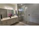 Modern bathroom with a double vanity, large mirror, and luxurious walk-in shower at 6225 S Boulder St, Gilbert, AZ 85298