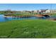 Beautiful community park with a serene pond and fountain amidst green lawns at 6225 S Boulder St, Gilbert, AZ 85298