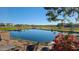 Relaxing community pond view with manicured landscaping and neighborhood homes at 6225 S Boulder St, Gilbert, AZ 85298