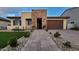 Inviting single Gathering home with manicured lawn, stone accents, and a two-car garage at 6225 S Boulder St, Gilbert, AZ 85298