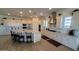 Spacious kitchen featuring white cabinets, stainless steel appliances, and a large granite island at 6225 S Boulder St, Gilbert, AZ 85298