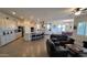 Open-concept living space featuring tile floors, a kitchen island, and dining area at 6225 S Boulder St, Gilbert, AZ 85298