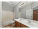 Bathroom featuring a dual sink vanity, large mirror, and shower-tub combination at 6993 S Roger Way, Chandler, AZ 85249