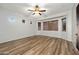 Large bedroom featuring wood floors, bay windows, and ceiling fan at 6993 S Roger Way, Chandler, AZ 85249