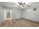 Bedroom featuring wood floors, three small windows, and ceiling fan at 6993 S Roger Way, Chandler, AZ 85249