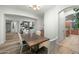 Spacious dining area featuring wood floors and direct view to living room fireplace at 6993 S Roger Way, Chandler, AZ 85249