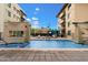 A refreshing community pool framed by stylish buildings and relaxing lounging areas at 7300 E Earll Dr # 3016, Scottsdale, AZ 85251