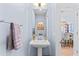 Chic powder room featuring a pedestal sink, modern fixtures, and stylish decor at 7300 E Earll Dr # 3016, Scottsdale, AZ 85251