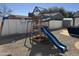 Backyard features a playset and a low maintenance gravel yard at 7350 E Pueblo Ave, Mesa, AZ 85208