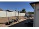 Backyard with a stone patio, swing set, and space for outdoor entertaining at 7350 E Pueblo Ave, Mesa, AZ 85208