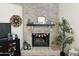 Stone fireplace decorated with Easter themed decor, creating a festive and inviting focal point in the home at 7350 E Pueblo Ave, Mesa, AZ 85208