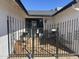 View of the tiled front porch featuring decorative iron fencing for added privacy and curb appeal at 7350 E Pueblo Ave, Mesa, AZ 85208