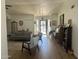 Bright and airy living room features hardwood floors, comfortable seating, and ample natural light from the front door at 7350 E Pueblo Ave, Mesa, AZ 85208