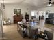 Spacious living room with a piano, complemented by neutral decor and natural light, creating a cozy atmosphere at 7350 E Pueblo Ave, Mesa, AZ 85208