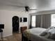 Serene main bedroom with ceiling fan, featuring ample natural light and walk in closet at 7350 E Pueblo Ave, Mesa, AZ 85208