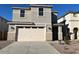 Charming two-story home featuring a modern design, neutral color palette, and a two-car garage at 7418 W Rovey Ave, Glendale, AZ 85303