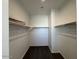 Spacious walk-in closet with shelving and ample storage space for clothing and accessories at 7418 W Rovey Ave, Glendale, AZ 85303