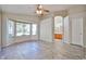 Large main bedroom with a ceiling fan, bay windows, and an en-suite bathroom at 7642 W Carlota Ln, Peoria, AZ 85383