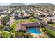 Aerial view of the community pool and spa, lush landscaping and surrounding neighborhood at 7912 E Plaza Ave, Scottsdale, AZ 85250