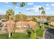 Aerial view of the community clubhouse with manicured landscaping, palm trees and water feature at 7912 E Plaza Ave, Scottsdale, AZ 85250