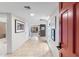 Bright entryway with tile flooring, modern art, and a view into the living area at 7912 E Plaza Ave, Scottsdale, AZ 85250