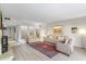 Bright living room featuring a cozy seating area with a fireplace at 7912 E Plaza Ave, Scottsdale, AZ 85250