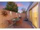 Private patio with a small table and chairs, perfect for enjoying the outdoors at 7912 E Plaza Ave, Scottsdale, AZ 85250