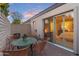 Secluded patio with stylish outdoor seating and an entry to the interior at 7912 E Plaza Ave, Scottsdale, AZ 85250