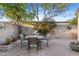 Charming brick patio with outdoor dining under a mature shade tree at 7912 E Plaza Ave, Scottsdale, AZ 85250