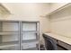 An organized walk-in closet with shelving and a built in desk at 7912 E Plaza Ave, Scottsdale, AZ 85250