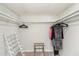 Walk-in closet offering ample storage with built-in shelving and hanging rods at 7912 E Plaza Ave, Scottsdale, AZ 85250