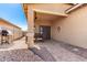 Covered back patio features a dining area and BBQ, perfect for outdoor entertaining and relaxation at 828 W Leadwood Ave, San Tan Valley, AZ 85140