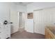 Neutrally decorated bedroom featuring a closet and view to the hallway at 828 W Leadwood Ave, San Tan Valley, AZ 85140