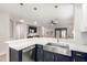 Stylish kitchen features an undermount sink, white countertops, navy cabinets, and stainless steel appliances at 828 W Leadwood Ave, San Tan Valley, AZ 85140