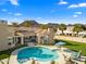 Aerial view of an expansive backyard with pool, spa, covered patio, and mountain views at 8315 N Sendero Tres M --, Paradise Valley, AZ 85253