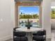 Charming dining area offers views of the backyard pool and patio through a picture window at 8315 N Sendero Tres M --, Paradise Valley, AZ 85253