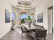 Elegant dining room with modern chandelier and scenic mountain views at 8315 N Sendero Tres M --, Paradise Valley, AZ 85253