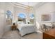 Sun-filled main bedroom featuring architectural windows, tray ceilings, and a designer chandelier at 8315 N Sendero Tres M --, Paradise Valley, AZ 85253