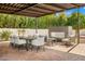 Covered patio features an outdoor dining area, fireplace, and comfortable seating, creating an ideal space for relaxing and entertaining at 8315 N Sendero Tres M --, Paradise Valley, AZ 85253